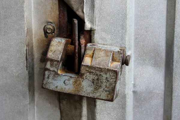 Rusty door lock. Antique rusty lock on a medieval wooden door