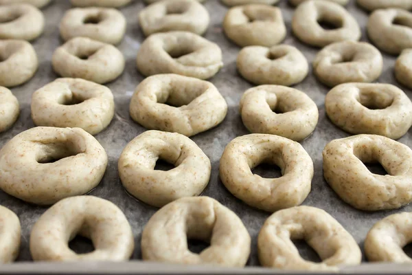 Raw cookie dough on a baking sheet with parchment. Pastry dough. Cooking concept