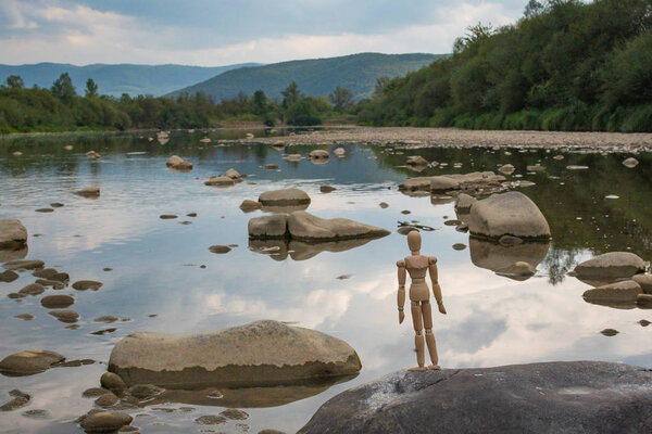 Articulated little man contemplates
