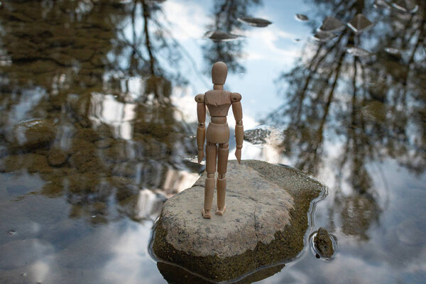 Articulated little man contemplates