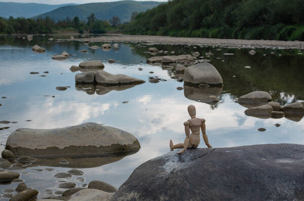 Articulated little man contemplates