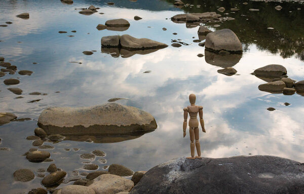 Articulated little man contemplates