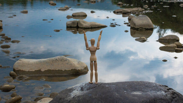 Articulated little man contemplates