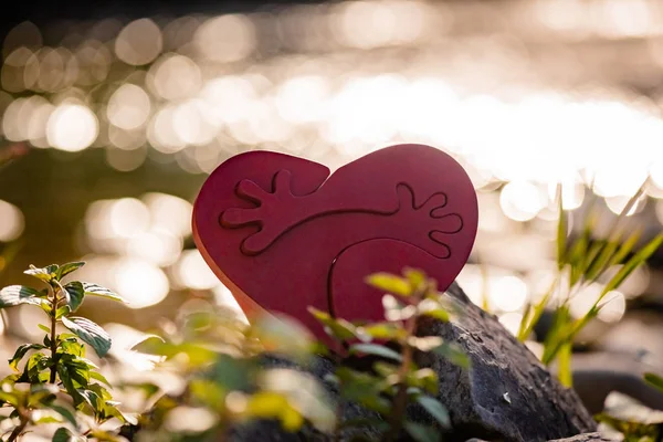 Heart with hugs on nature background