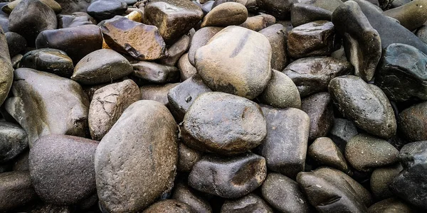 A pile of stones washed up by a mountain river