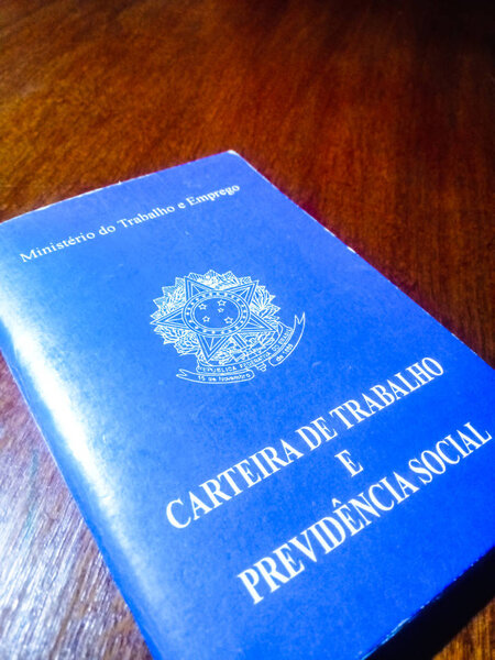 Brazilian document work and social security on wooden table