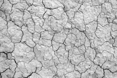 Kuru çatlamış toprak. Çamur, kumlu, kuru toprak çölde güneşin altında. Susuz