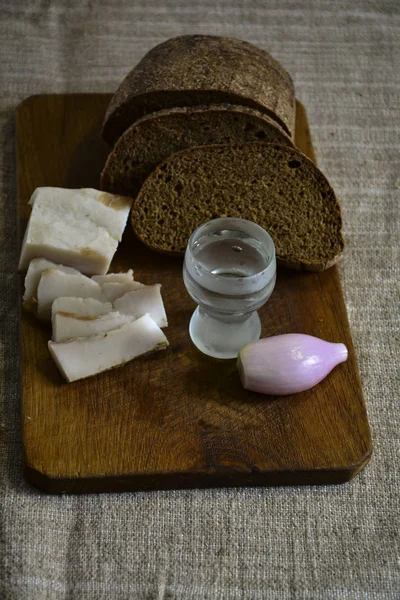 Freshly Baked Bread Wooden Cutting Board Bacon Onions Shot Vodka — Stock Photo, Image