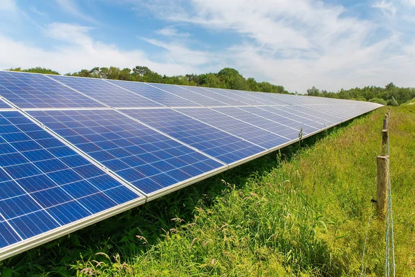 Long diagonal row of blue solar panels in Holland