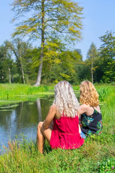 Blond Red Hairedeuropean Woman Sitting Together Waterfront — Stock Photo, Image