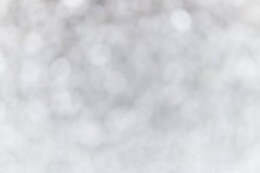 Gümüş ve beyaz bokeh ışıkları söndü. soyut arkaplan.