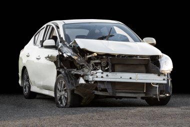 Damaged crash car from accident and ground isolated on black background with clipping path clipart