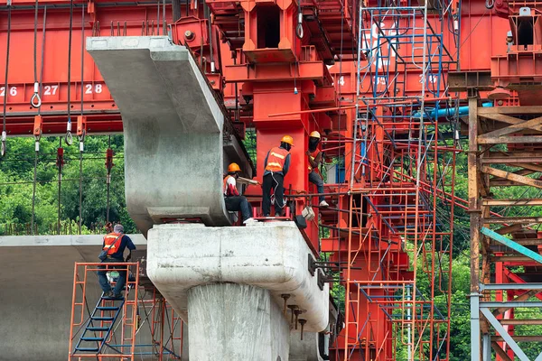 Workman with heavy industrial equipment at construction site for build superhighway for industrial estate