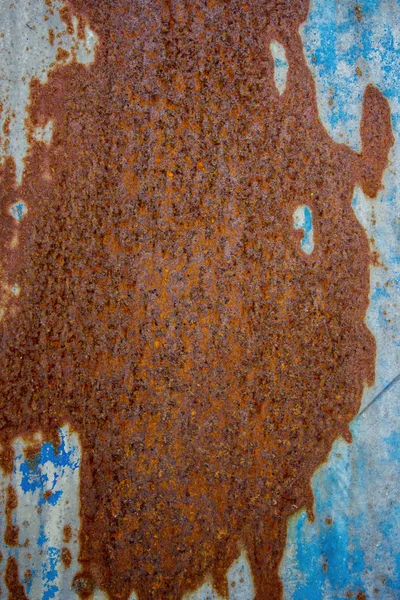 Blue and orange background with ink texture on metal. Blue colored abstract.