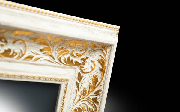 Mirror frame in the ancient style. Part of ornate. Close-up on white background