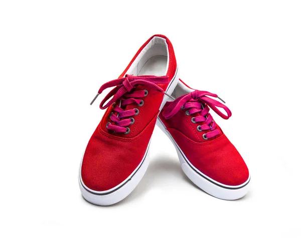 Een paar rode kleur canvas schoenen geïsoleerd op wit — Stockfoto