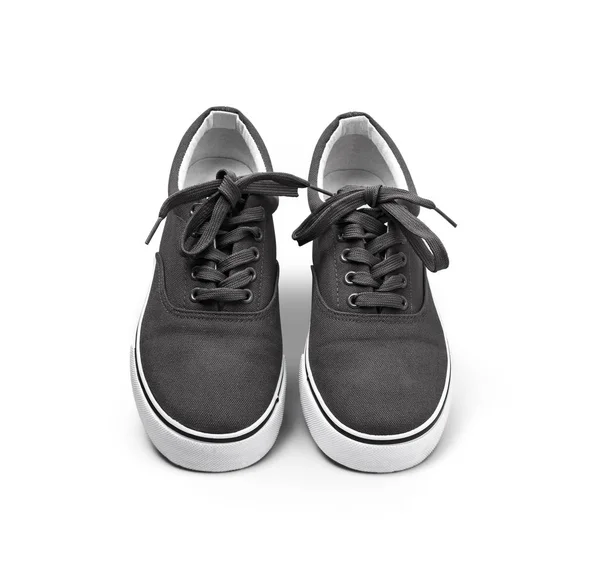 Um par de sapatos de lona preta isolados em branco — Fotografia de Stock