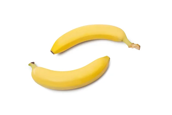 Un primo piano di un paio di banane giallo chiaro isolate su bianco — Foto Stock