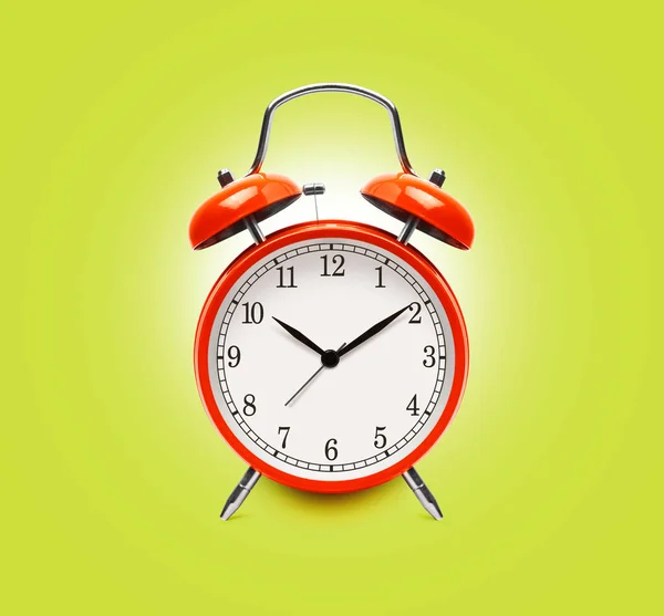 Reloj despertador rojo aislado en amarillo —  Fotos de Stock
