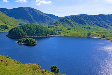 Capturing the beautiful and picturesque nature and open spaces, at Haweswater Reservoir, in the Lake District.  Providing an awesome blend of risen roadside, sweeping valley, mountainous terrain, a gargantuan reservoir, lush greenery and rock forms. clipart