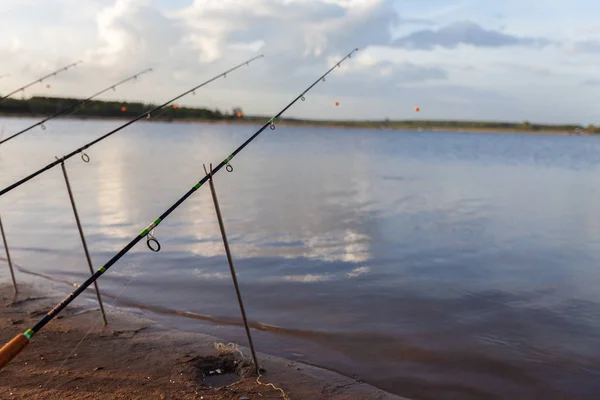 Fishing hook in the river at sunaet. Fishing tackle at the river