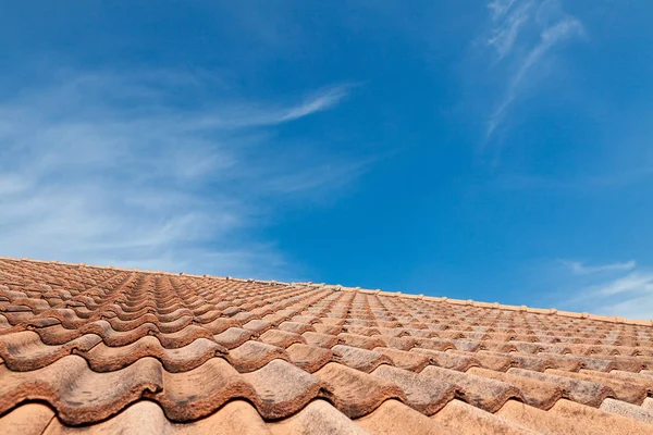 roof top on sky background. Close up of brown clay roof tiles. R