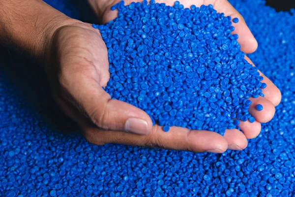 Blue plastic grain, plastic polymer granules,hand hold Polymer pellets, Raw materials for making water pipes, Plastics from petrochemicals and compound extrusion, resin from plant polyethylene.