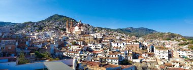 Mexico, Scenic panoramic view of Taxco historic center with colonial houses on the hills and famous Church of Santa Prisca de Taxco clipart