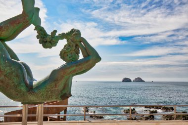 Mazatlan, Mexico-10 December, 2018: Sea Mermaid Statue located on scenic Mazatlan Promenade (Malecon) near the ocean shore and historic city center clipart