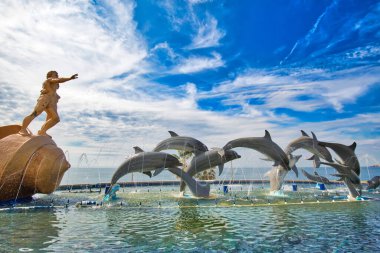 Mazatlan, Mexico-10 December, 2018: Dolphin Statue located on scenic Mazatlan Promenade (Malecon) near the ocean shore and historic city center clipart