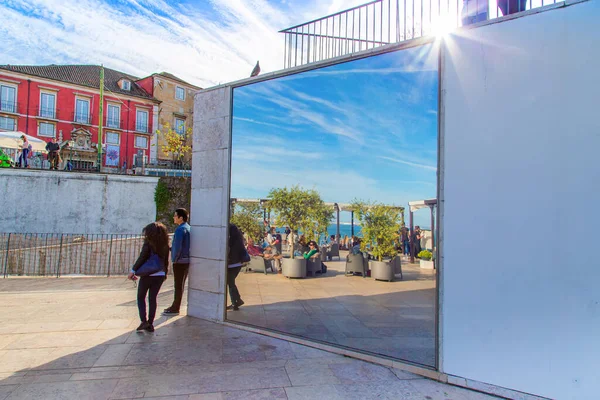 Lisbon, Portugal - February, 2020: People enjoying famous Alfama Lookout views in Lisbon