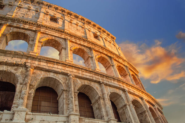 Famous Coliseum (Colosseum) of Rome at early sunset