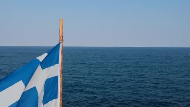Aerial View of Greek National Flag Waving on Coast of Aegean Sea — Stock Video
