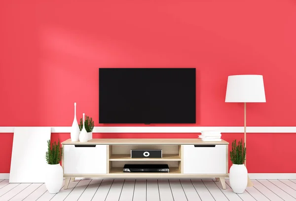 TV on cabinet in modern living room with lamp, plant on red wall — стоковое фото