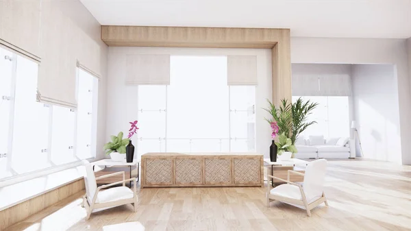 A living room with a sofa in a minimalist style White tropical style living room with wood grain floor