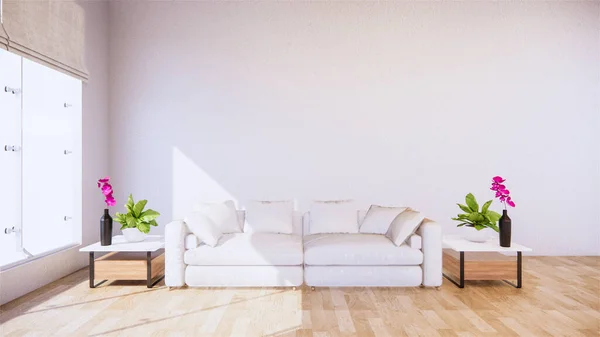 A living room with a sofa in a minimalist style White tropical style living room with wood grain floor