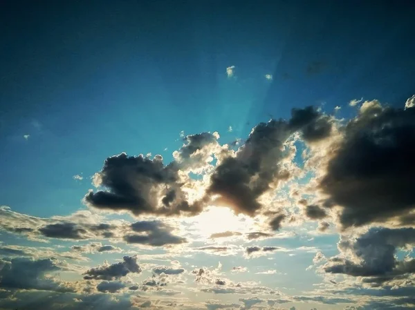 setting sun in the sky in thunder clouds