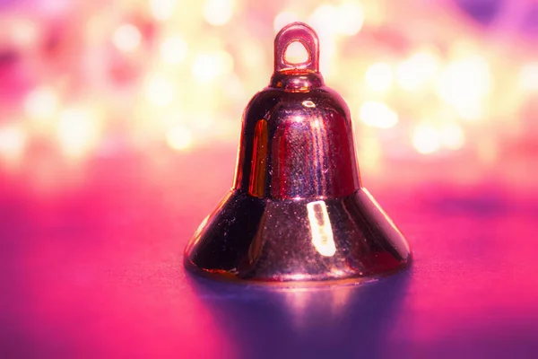 golden christmas bell on red background