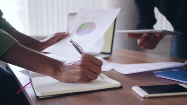 Business colleague with documents at desk in office — Stock Video