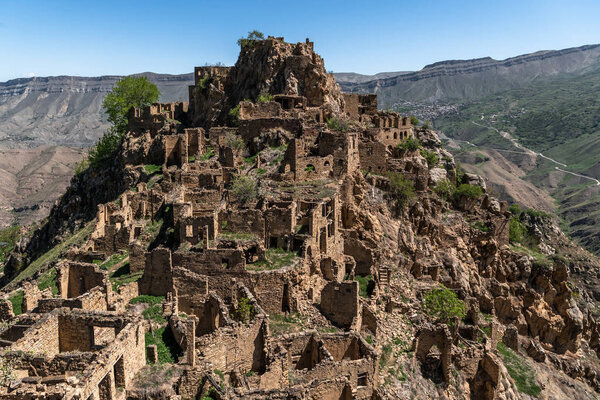 abandoned yellow village at the mountain plateau in Dagestan Russia