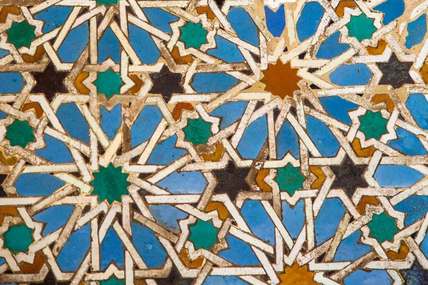 Arab tiles, ceramic mosaic of stars, azulejos of Alcazar in Seville (Reales Alczares de Sevilla), Andalusia, Spain