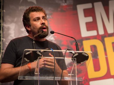Rio de Janeiro, Brazil - January 16 , 2018: Guilherme Boulos  delivers a speech at Casa Grande Theatre on a meeting for the freedom of Lula clipart