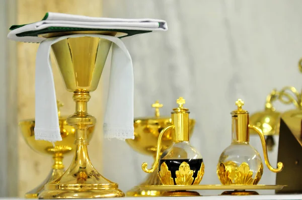 Golden cups of celebration in the church — Stock Photo, Image