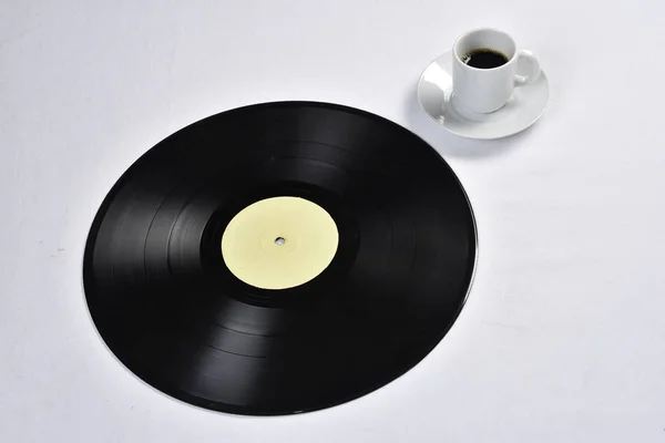 Viejo disco de vinilo con café —  Fotos de Stock
