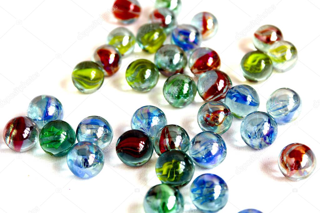 a lot of colorful glass balls on a white background