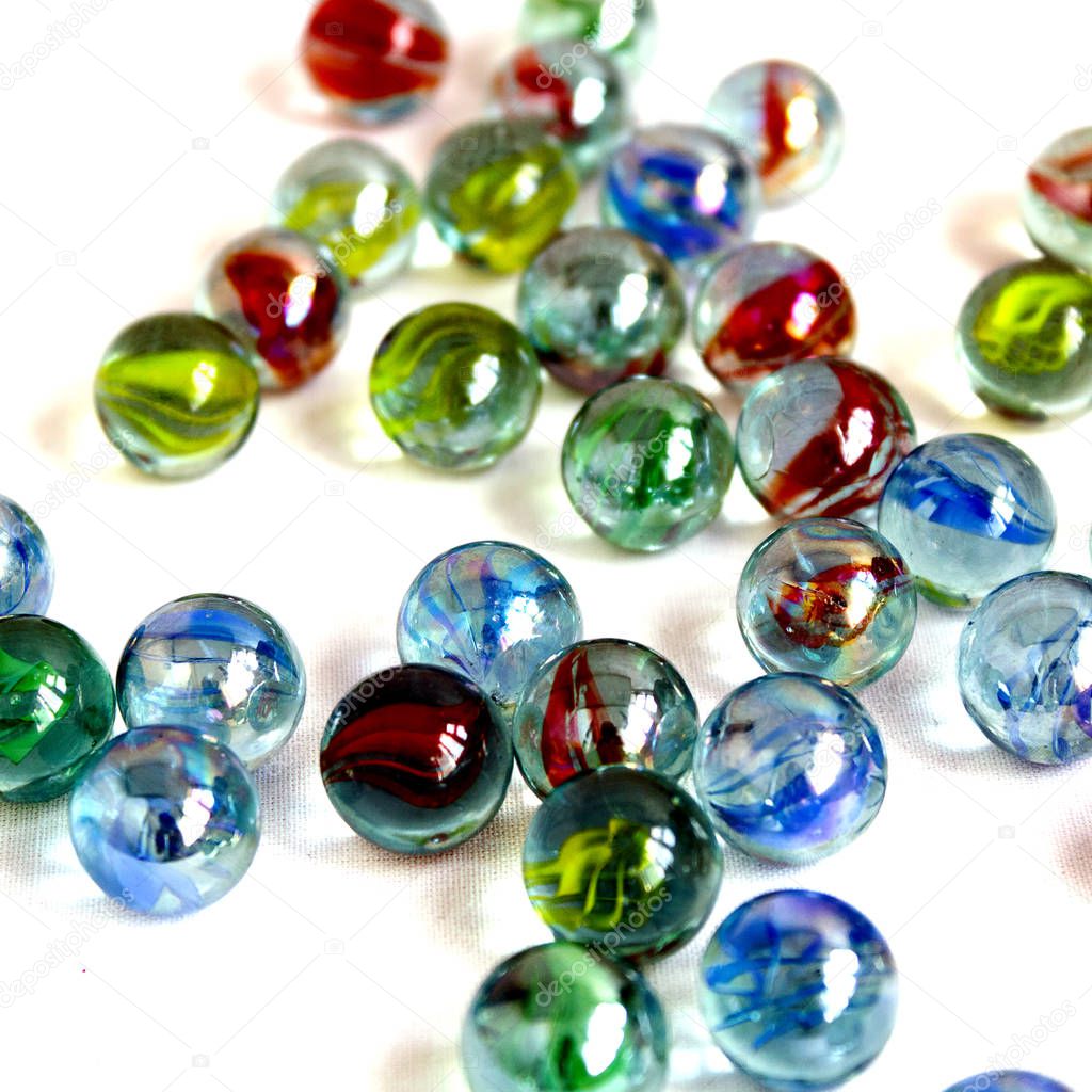 a lot of colorful glass balls on a white background