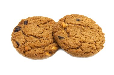 Bisküvi çikolatalı tereyağı, Kaju fıstığı ve bal aromalı. Gevrek lezzetli tatlı yemek ve yararlı çerez bir yığın. Beyaz arka planda yalıtılmış. 