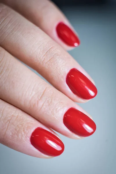 Female hand with a beautiful red manicure — Stock Photo, Image