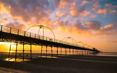 Sunset on the beach in Southport, England. clipart