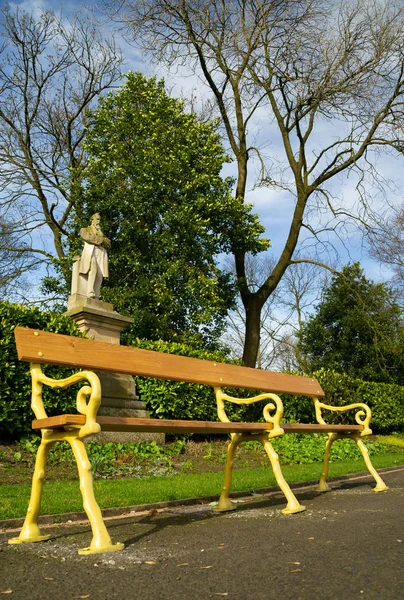 The old style park bench in Queen's Park, Bolton, England.